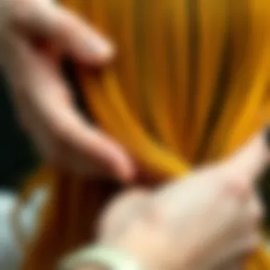 Application Technique for Yellow Dye Close-up of hands applying yellow dye to hair