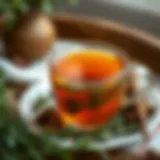 A serene view of a teacup filled with Kombucha tea surrounded by fresh herbs