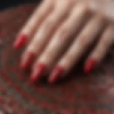 Elegant red nail art design featuring intricate patterns